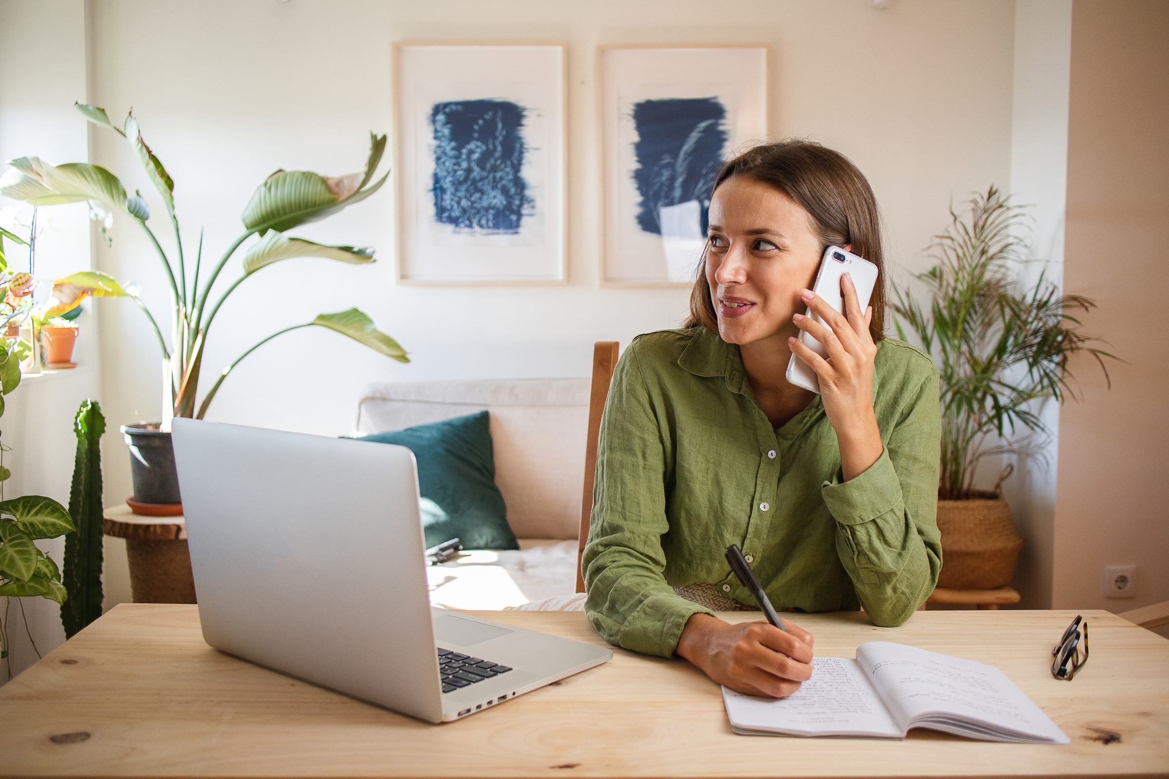 Woman Working from Home Talking on the Phone